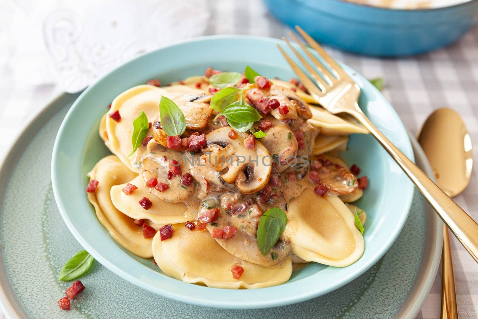 Italian tortelli pasta with a creamy mushroom sauce