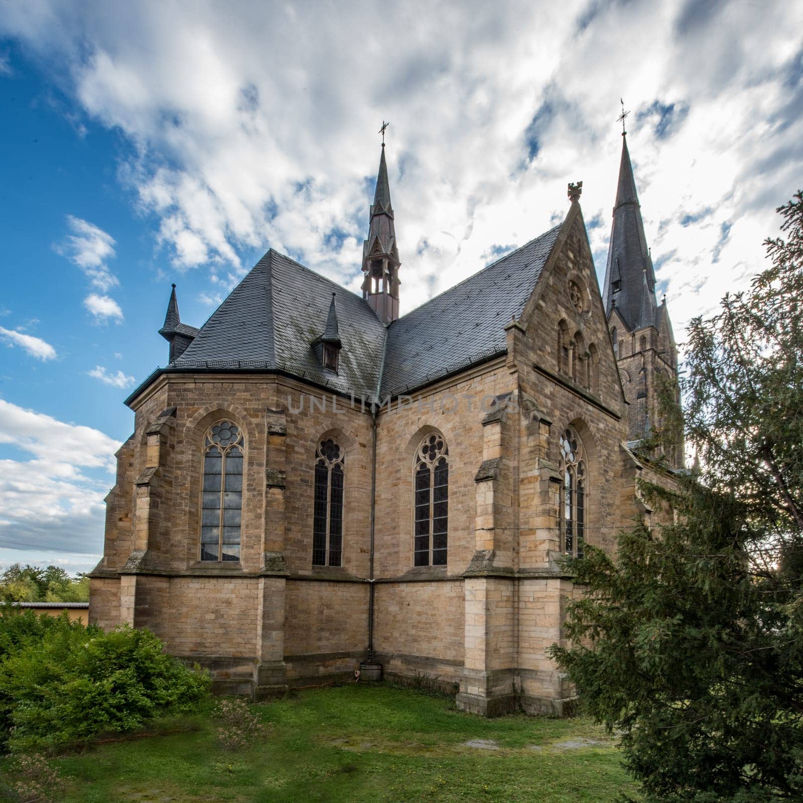 Catholic Church Edenkoben Germany Rhineland Palatinate with fountain and cloudy blue sky
