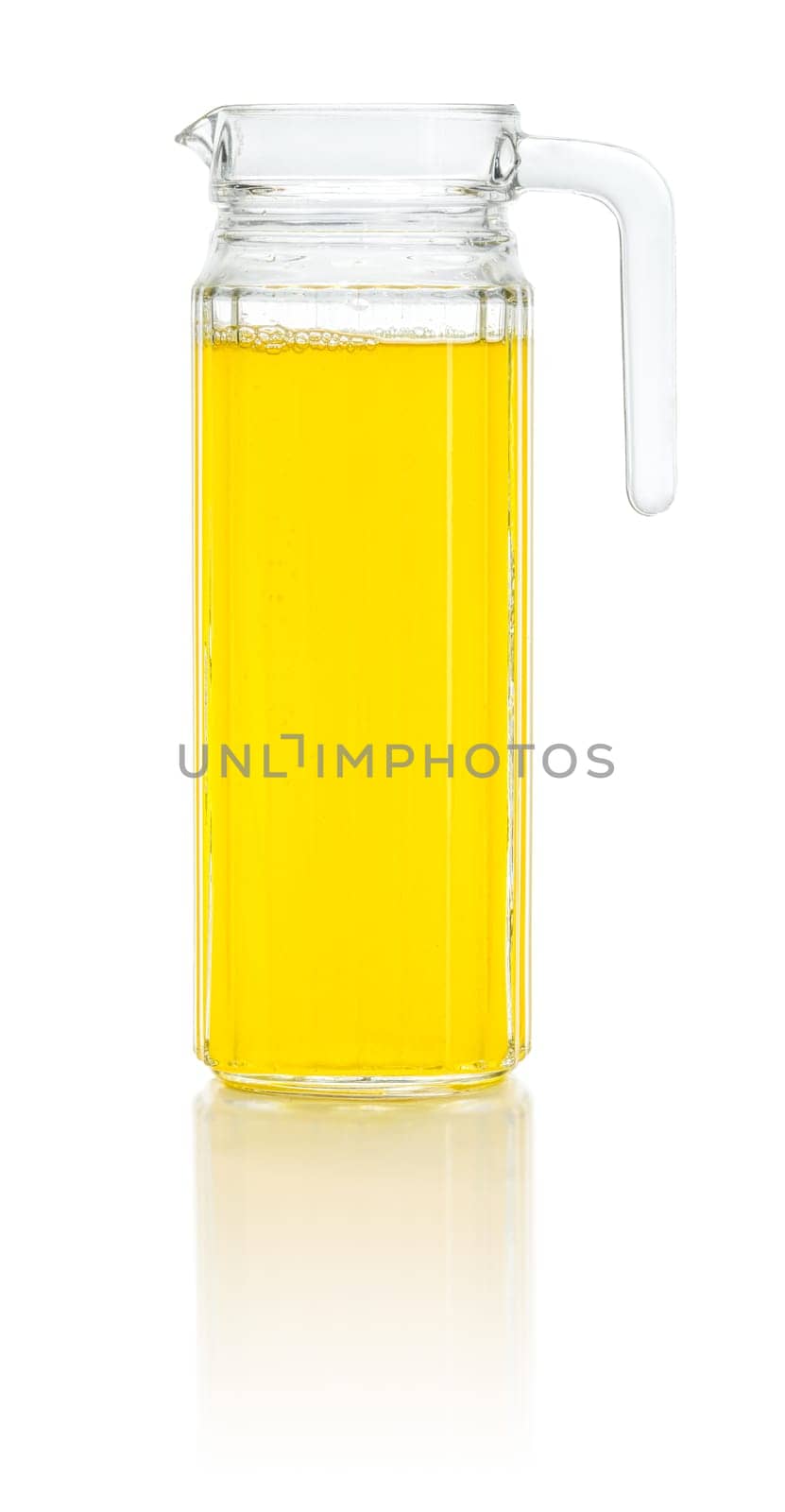 An orange soft drink in a pitcher