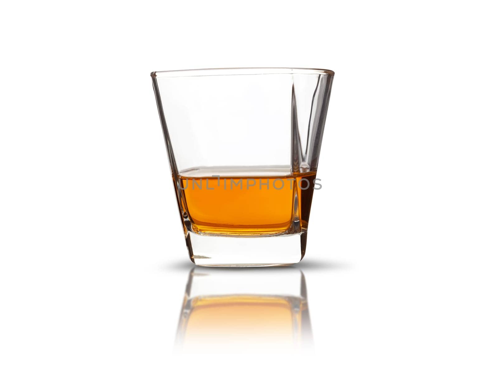 Glass of scotch whiskey isolated on a white background