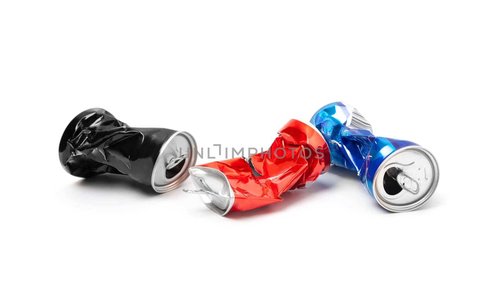 Compressed, broken aluminum cans isolated on white background closeup