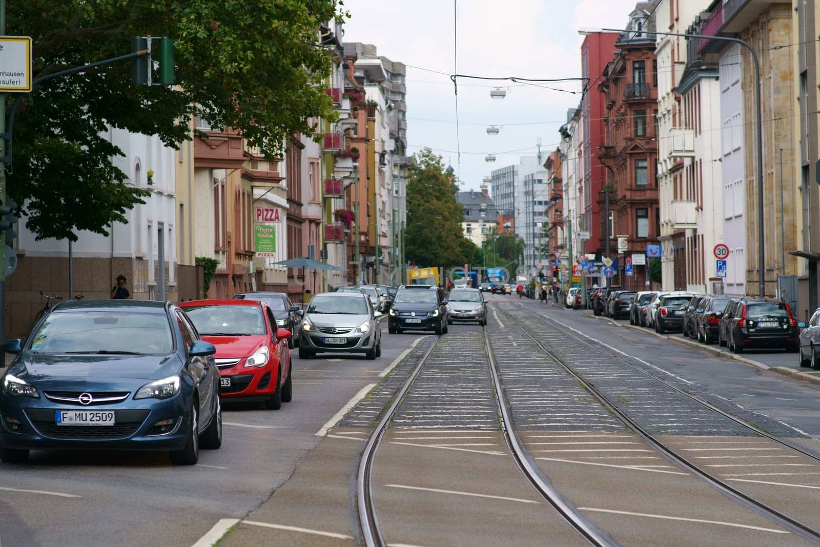 Frankfurt, Germany - August 03, 2019: Street traffic in a residential and commercial street in Sachsenhausen a district on August 03, 2019 in Frankfurt..