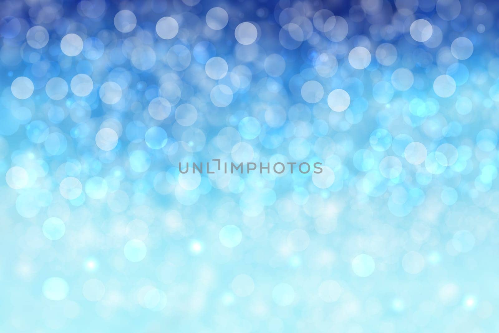 Abstract blurred festive winter christmas or Happy New Year background with shiny blue and white bokeh lighted snow landscape. Space for your design. Card concept.