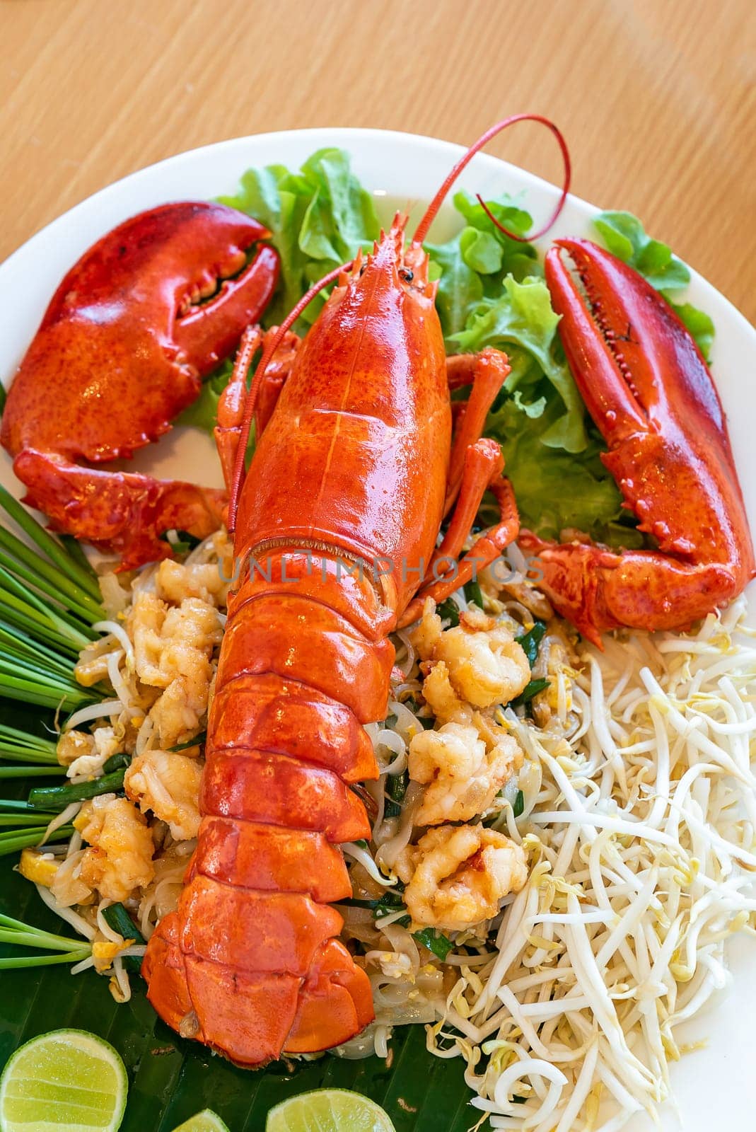Lobster Pad thai, stir fried Thai rice noodle pasta with whole lobster and lobster meat.