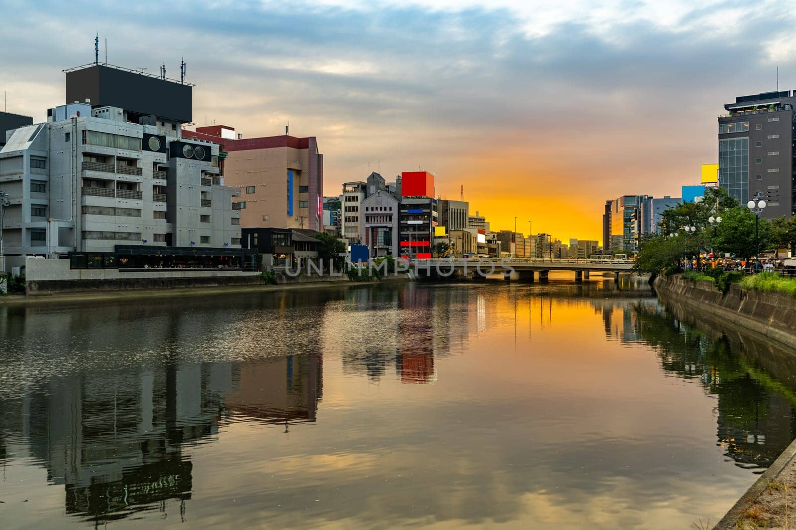 Fukuoka old town along naka river at Nakasukawabata sunset twilight. This area is favorite for tourist for Fukuoka Yatai, street Food stall,  for hangout at night.