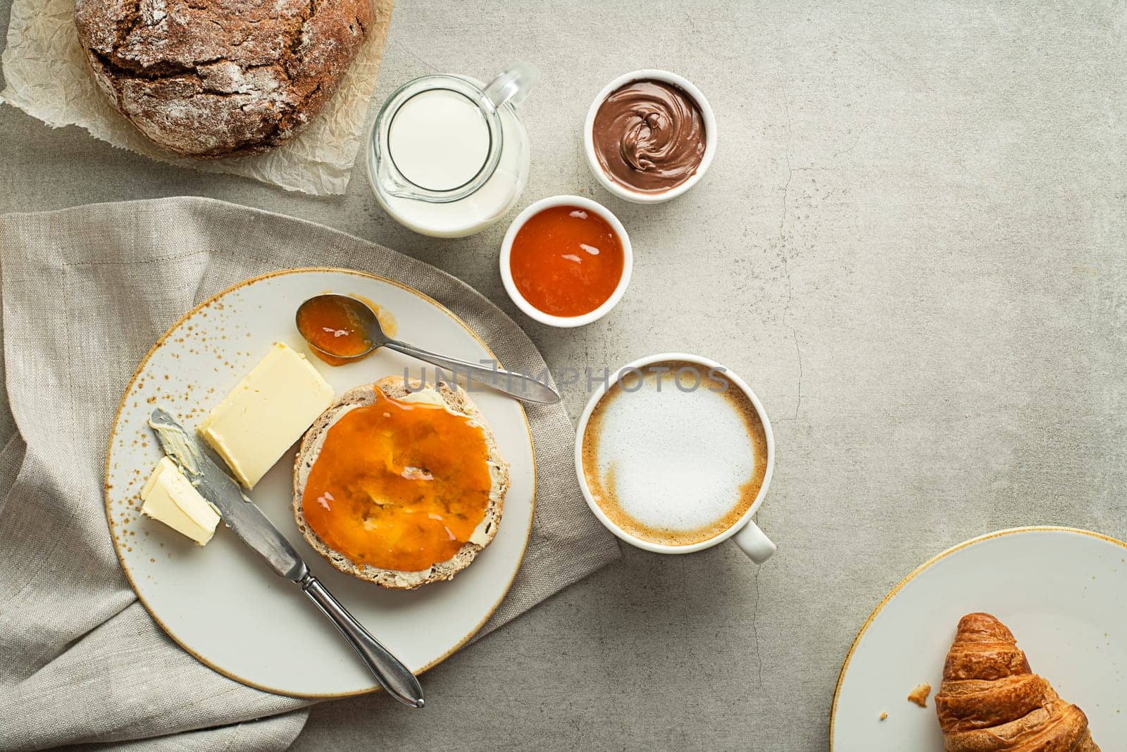 Breakfast served with coffee, bread, jam and butter. Continental delicious healthy breakfast table