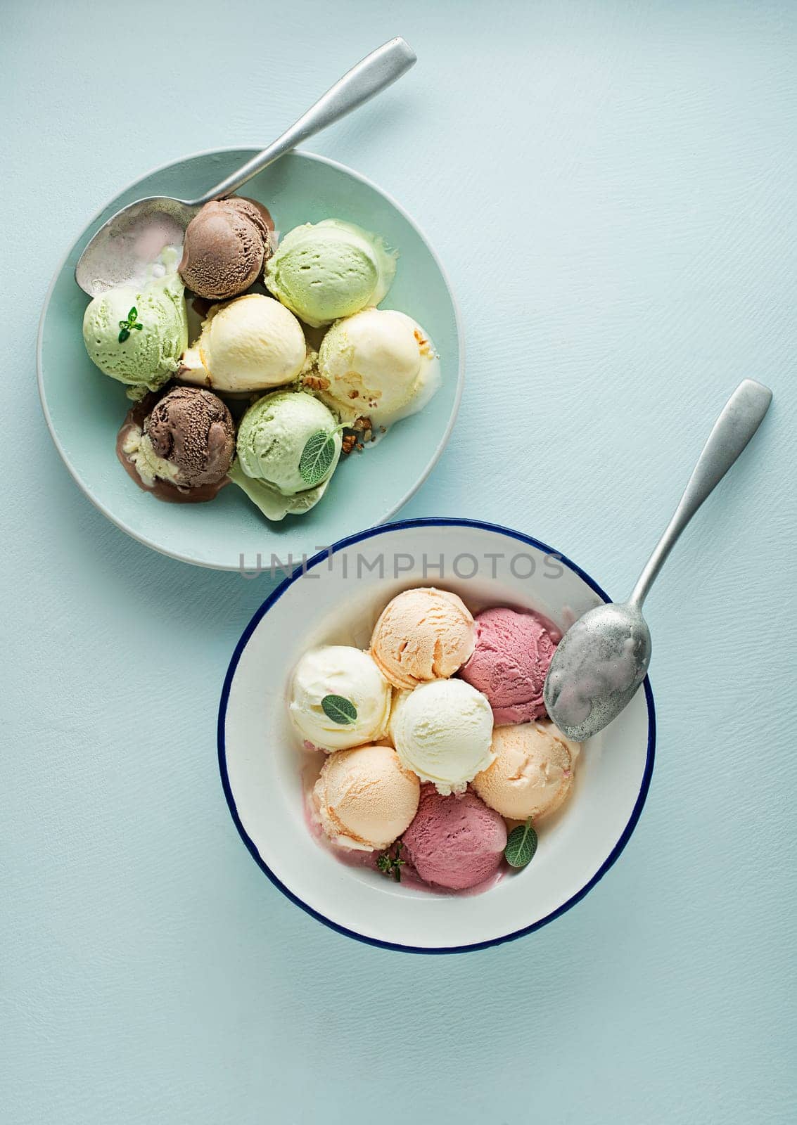 Set of soft ice cream scoops or frozen yoghurt of different colors and flavours with berries, nuts and fruits