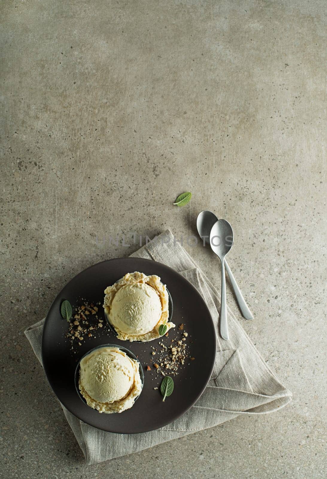 Homemade Organic Vanilla Ice Cream scoops in a plate close up