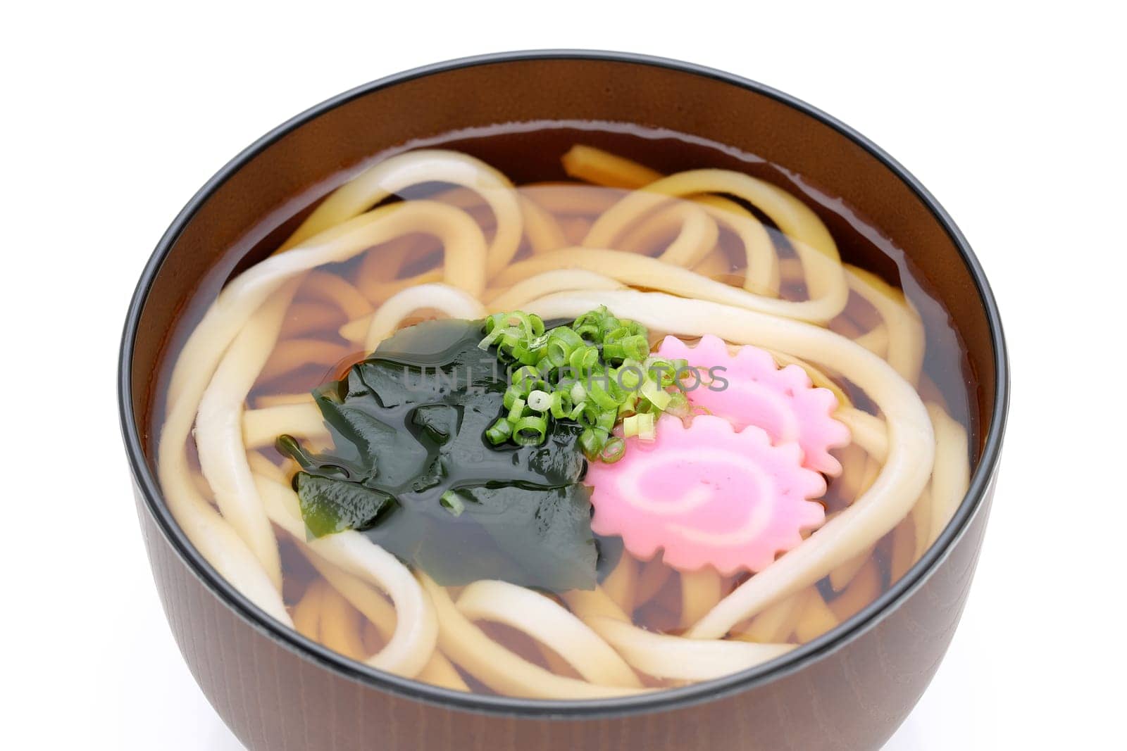 Japanese Kake udon noodles in a bowl on white background