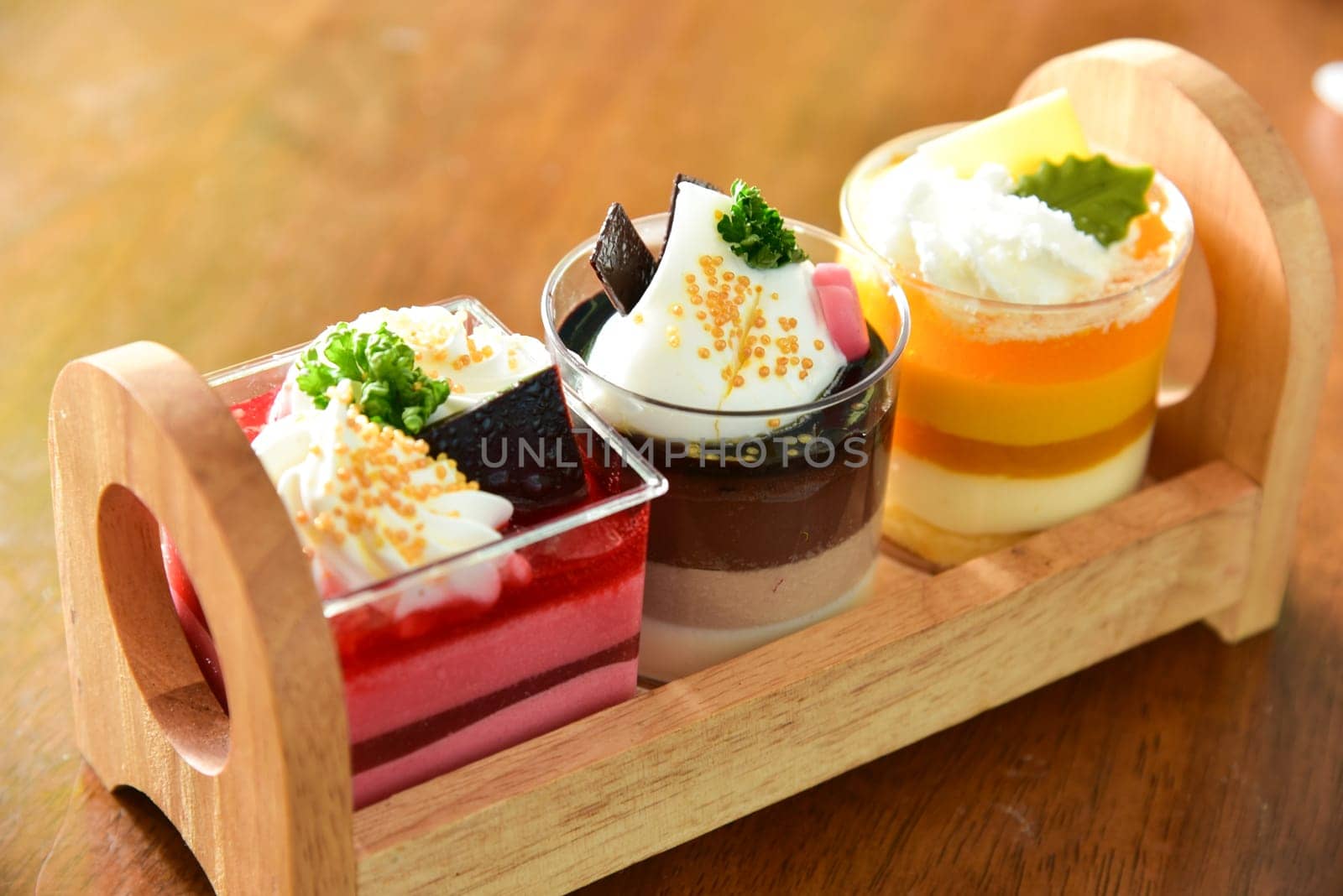 Beautiful cupcakes on wooden background, closeup