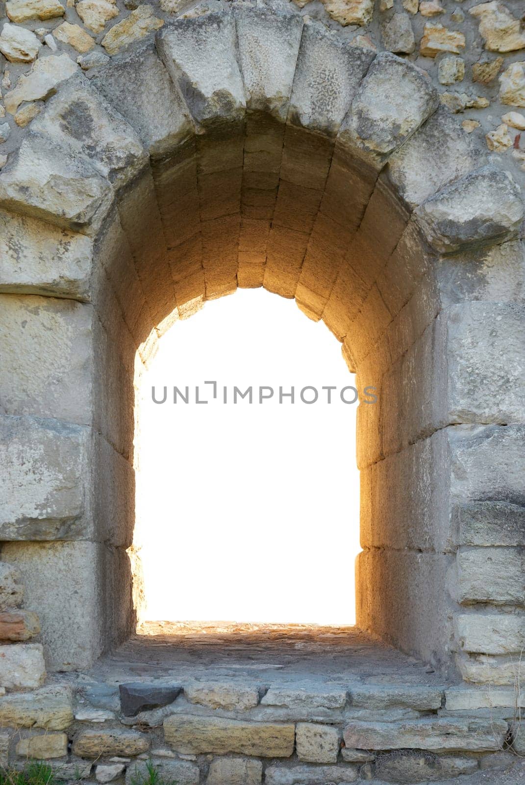 Exit in the ancient wall. Entrance to nowhere isolated on white background