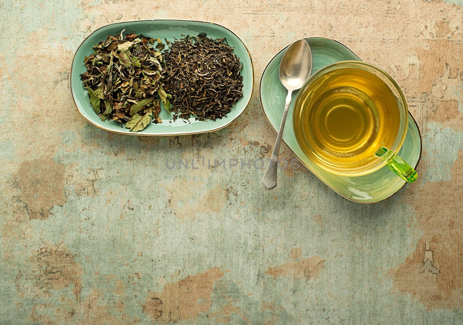 Cup of tea with dry tea collection of different types- classic black and green tea flavour