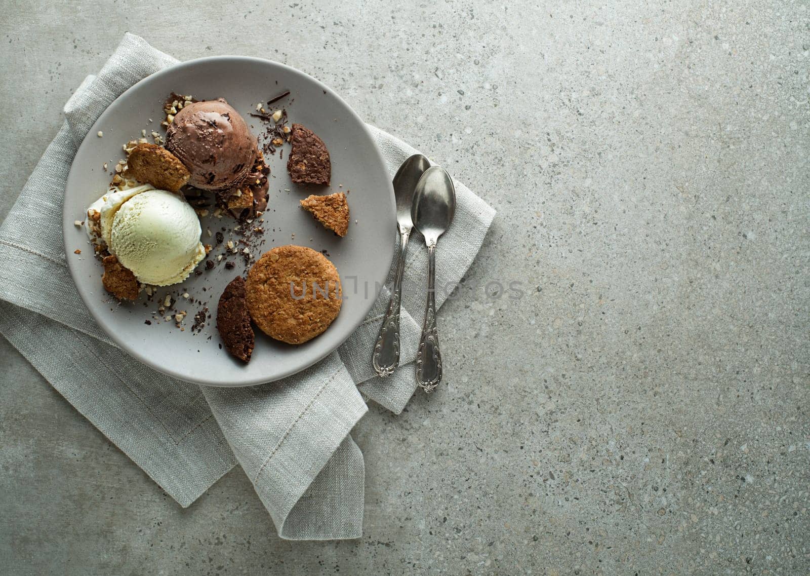 Homemade Organic chocolate and vanilla Ice Cream with biscuit in a plate close up