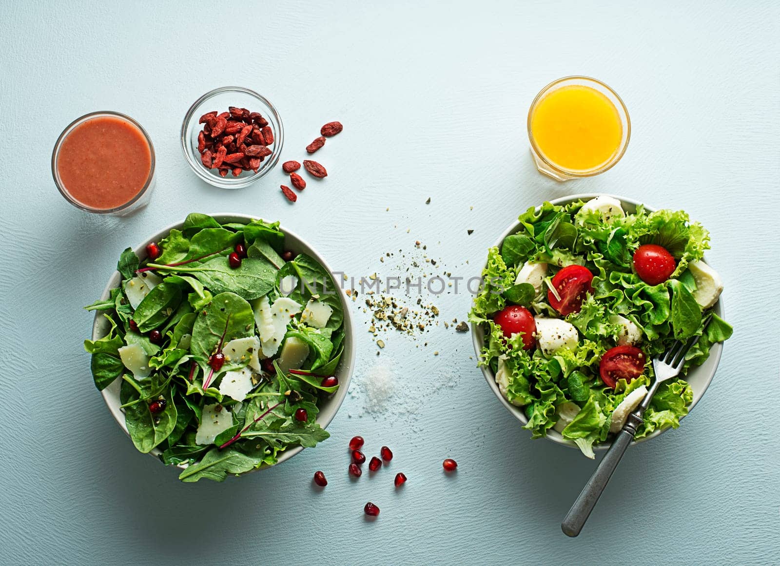 Healthy salads with spinach, cheese, tomato and seeds. Home made food. Concept for a tasty and healthy meal