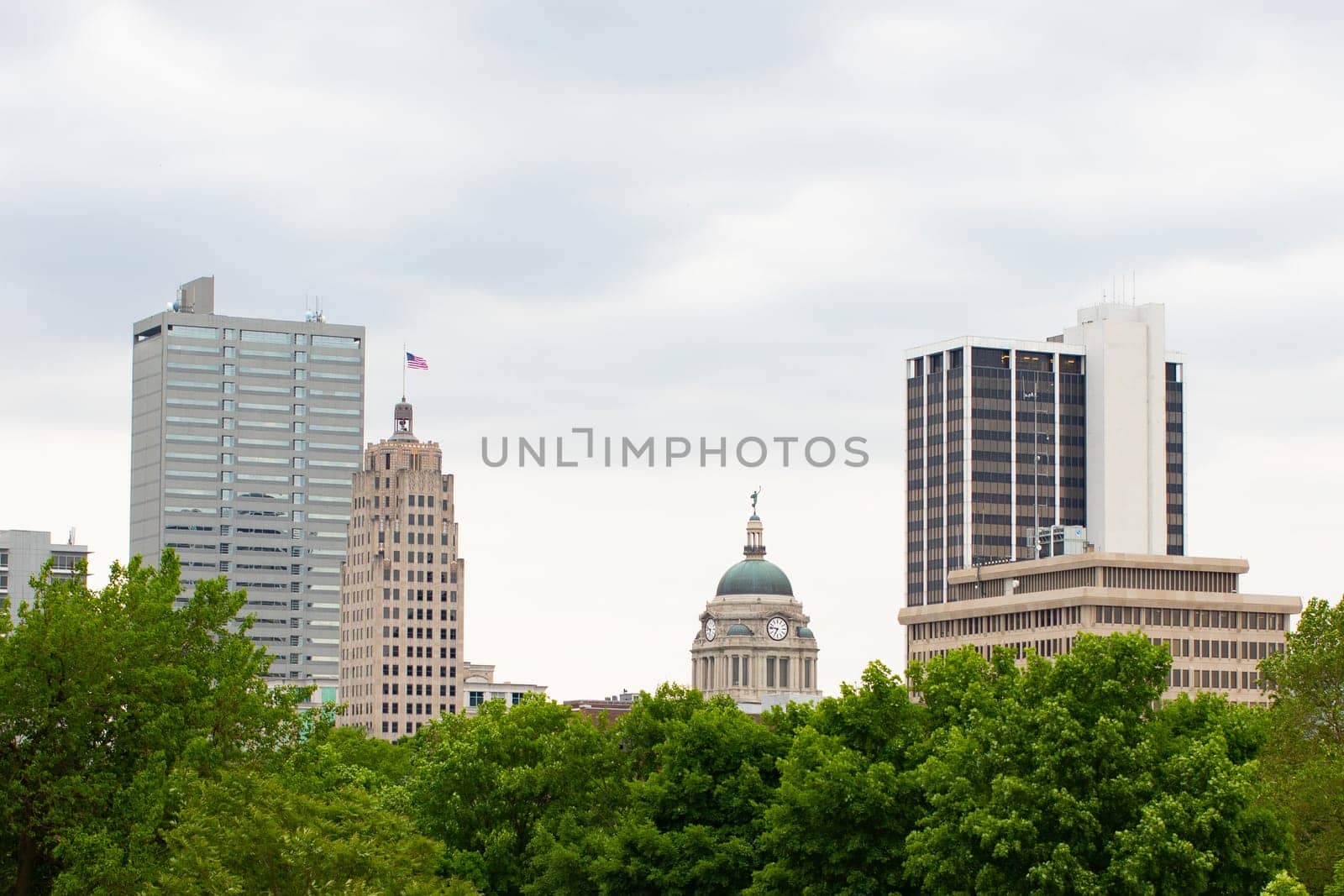 Fort Wayne, city in the state of Indiana, USA, the skyline emerges behind trees