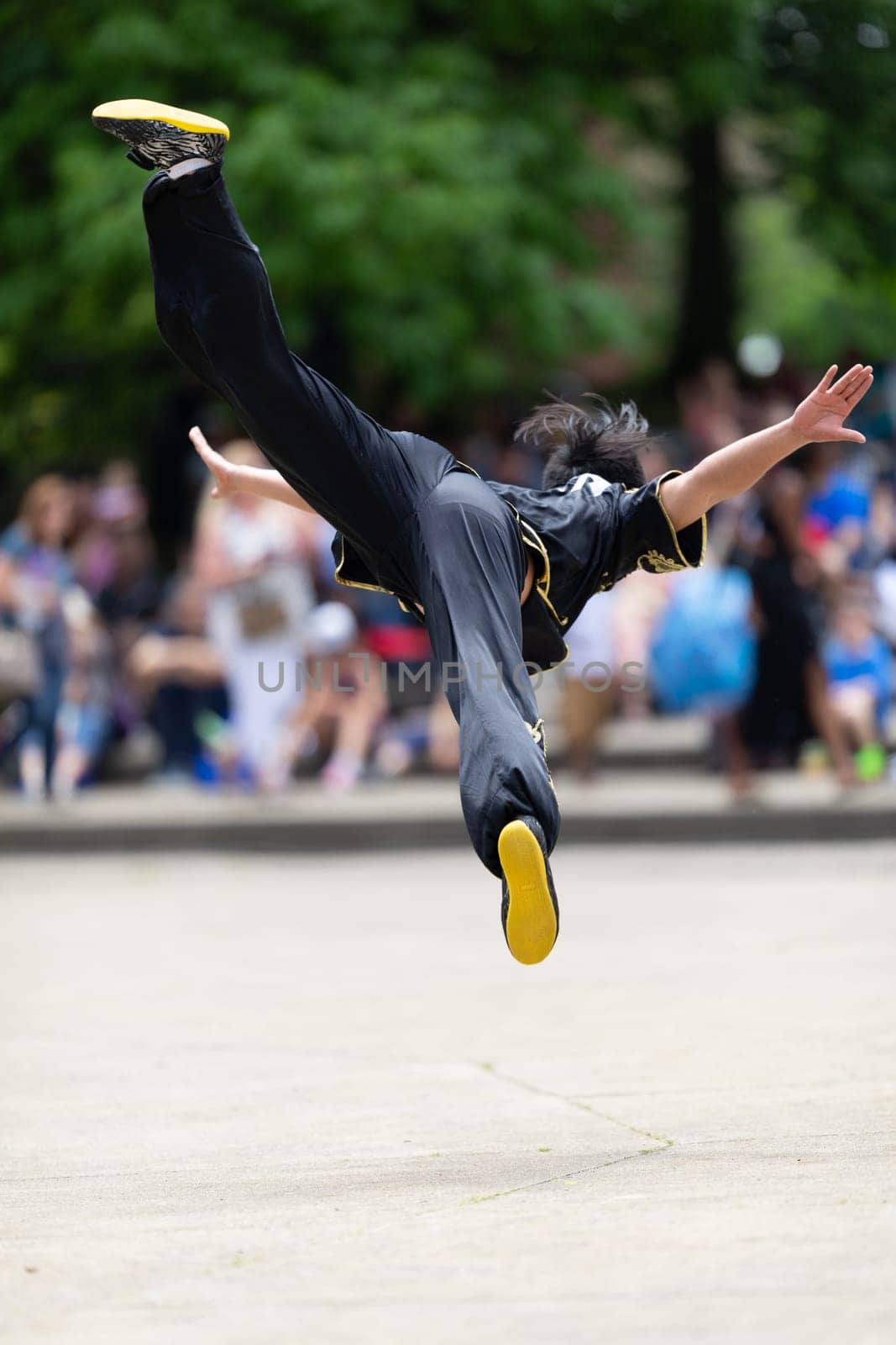 Columbus, Ohio, USA - May 26, 2019: Columbus Asian Festival, Franklin Park, Chinese man wearing traditional clothing displaying his martial arts skill