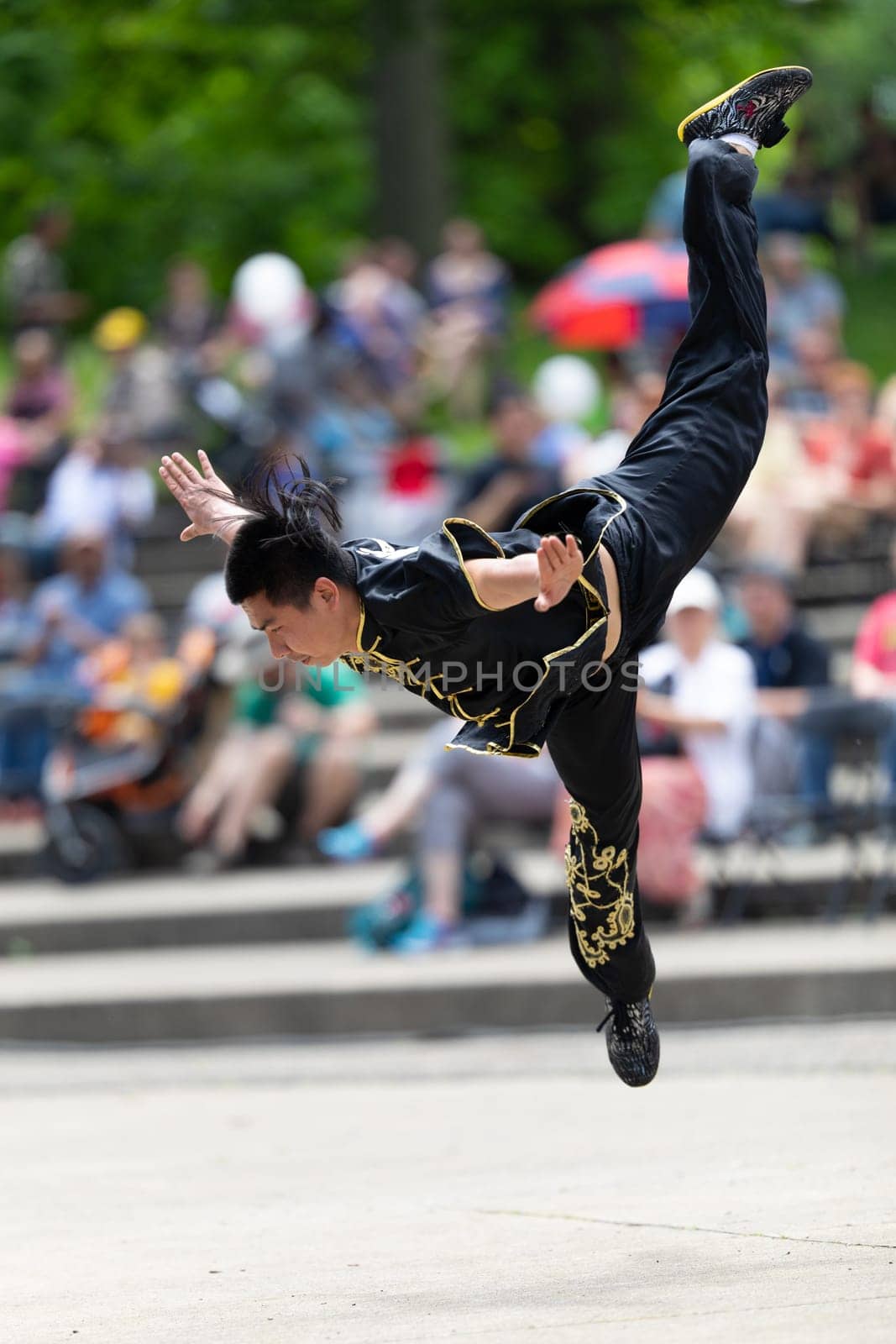 Columbus, Ohio, USA - May 26, 2019: Columbus Asian Festival, Franklin Park, Chinese man wearing traditional clothing displaying his martial arts skill