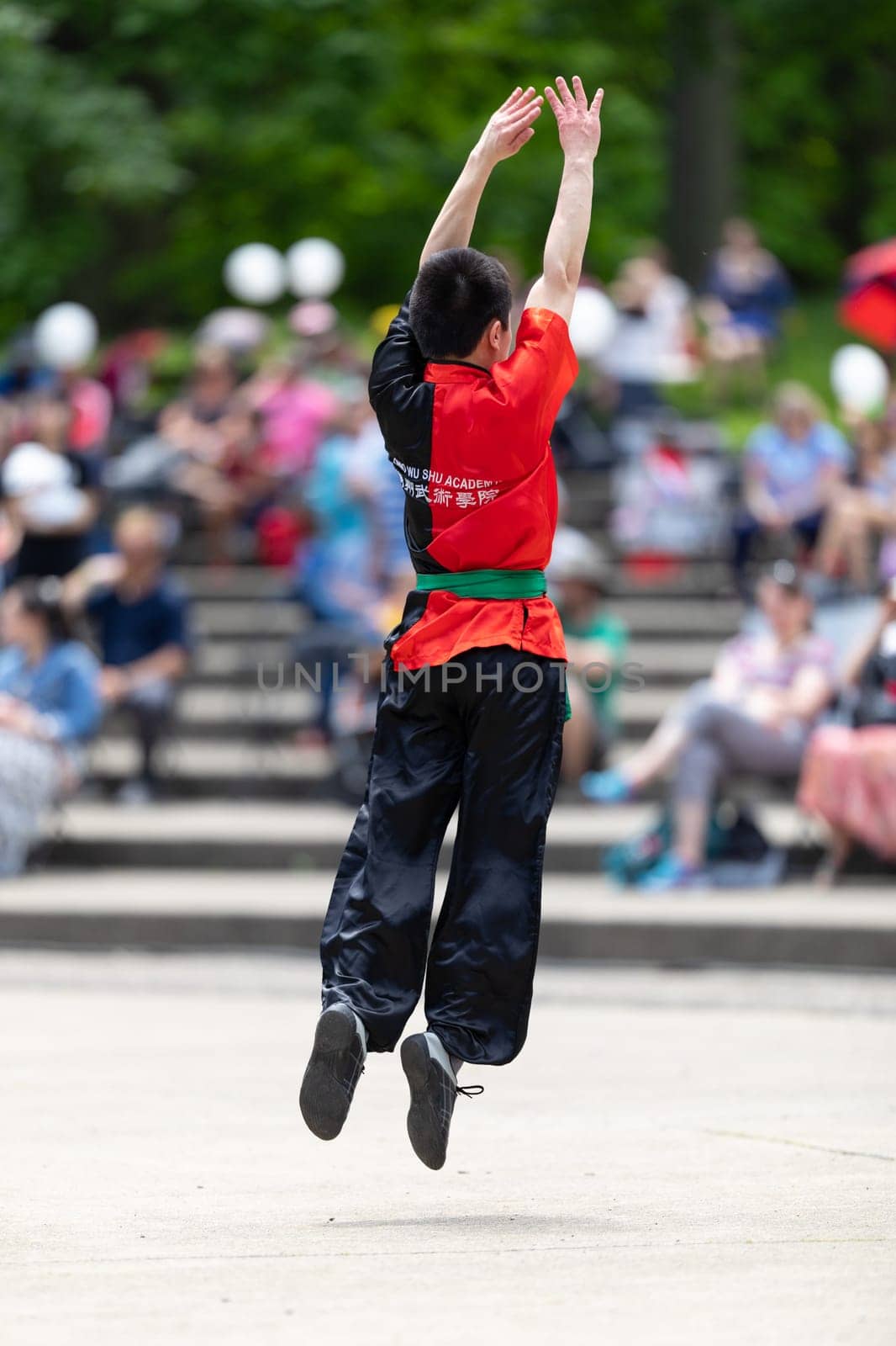 Columbus, Ohio, USA - May 26, 2019: Columbus Asian Festival, Franklin Park, Chinese boy wearing traditional chinese traditional clothing, performing a display of chinese martial arts