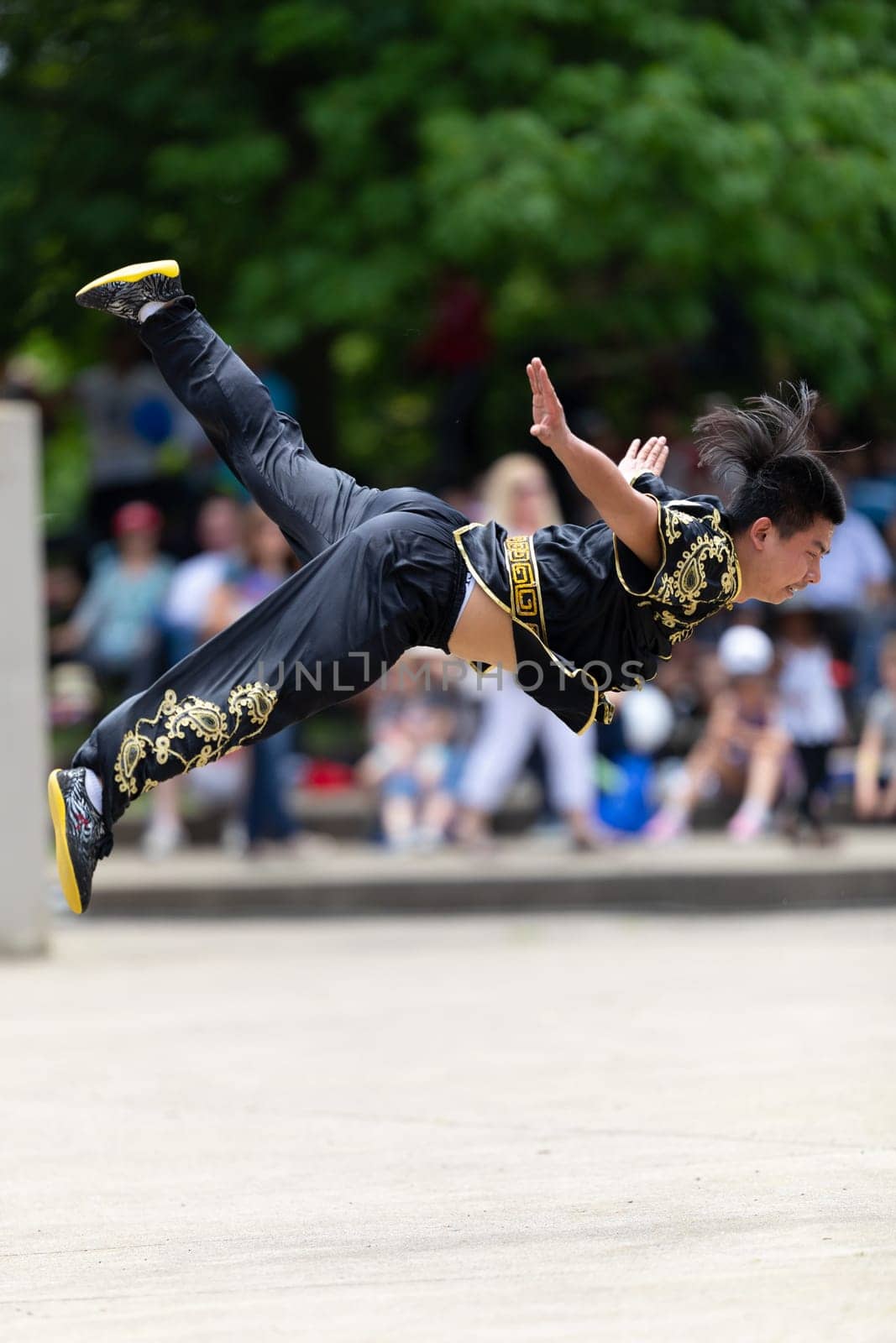 Columbus, Ohio, USA - May 26, 2019: Columbus Asian Festival, Franklin Park, Chinese man wearing traditional clothing displaying his martial arts skill