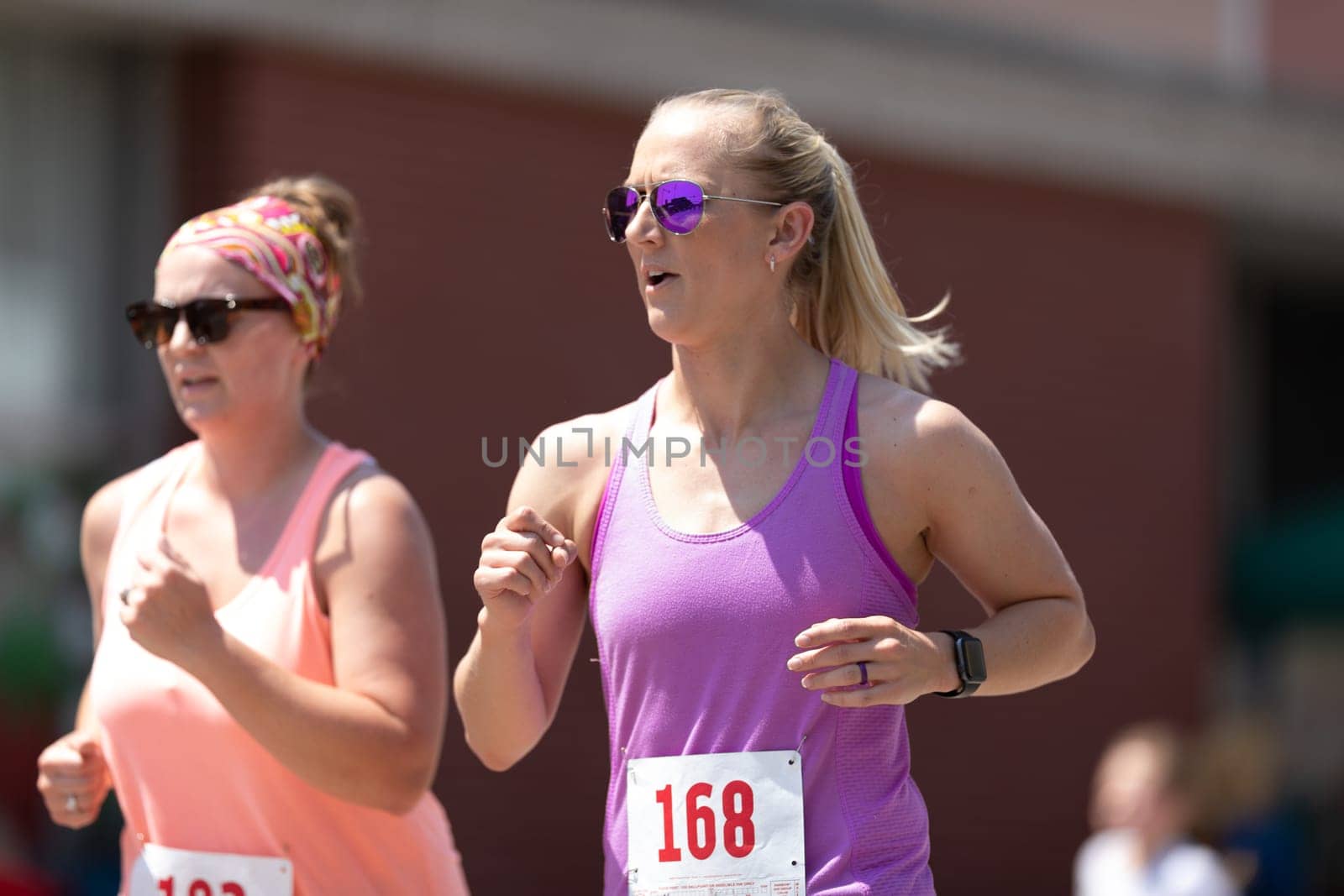 Buckhannon, West Virginia, USA - May 18, 2019: Strawberry Festival, women runing participating in a race prior to the parade