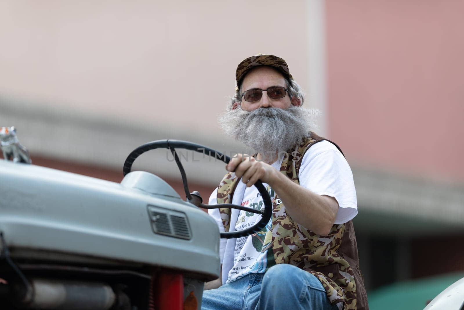 Buckhannon, West Virginia, USA - May 18, 2019: Strawberry Festival, Old Tractors being driven along Main Street during the parade