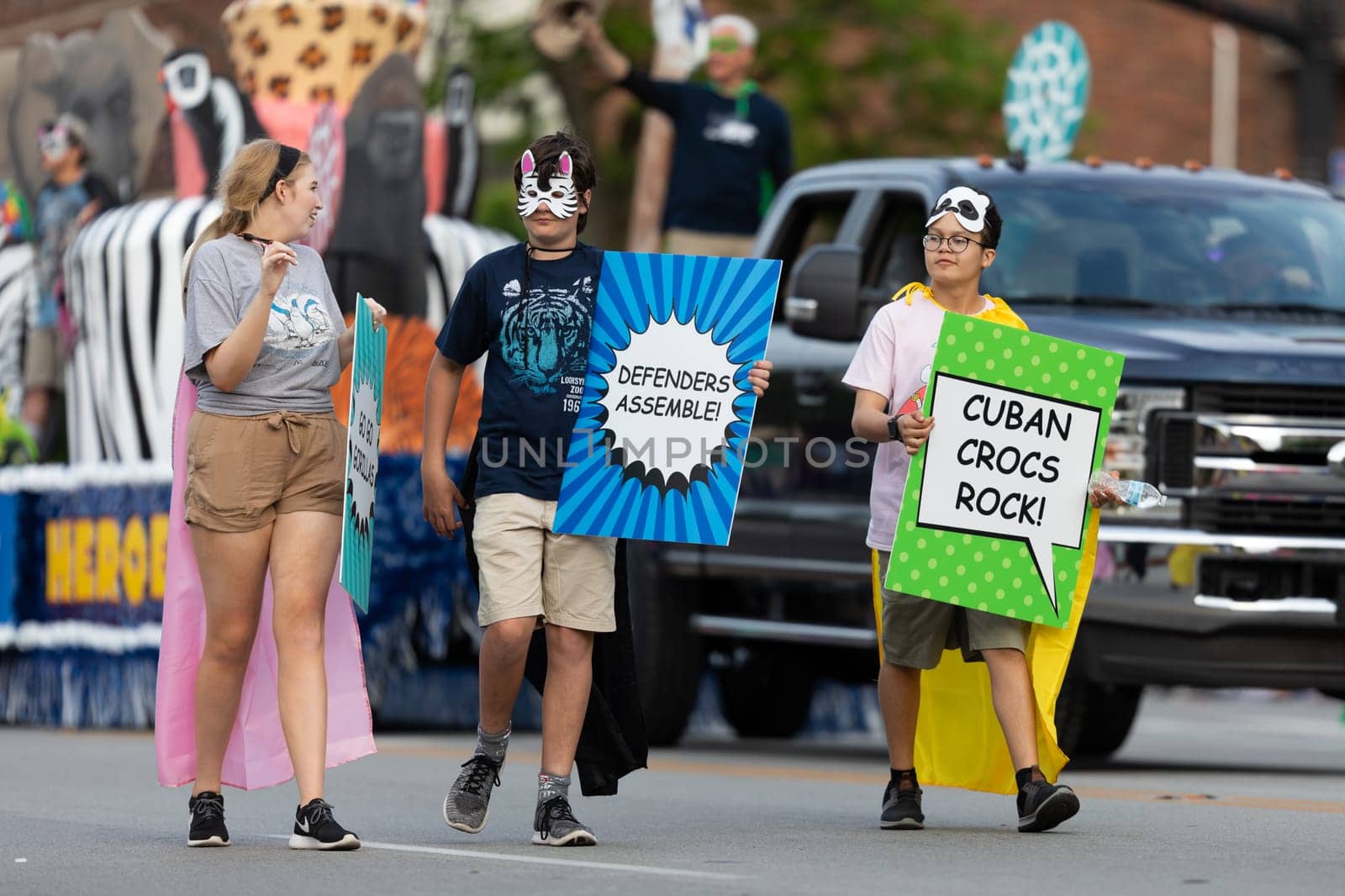 Louisville, Kentucky, USA - May 2, 2019: The Pegasus Parade, People holding signs promoting nature conservation during the parade