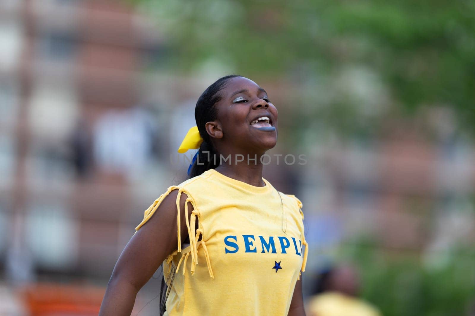 Louisville, Kentucky, USA - May 2, 2019: The Pegasus Parade, Young african american woman  dancing during the parade