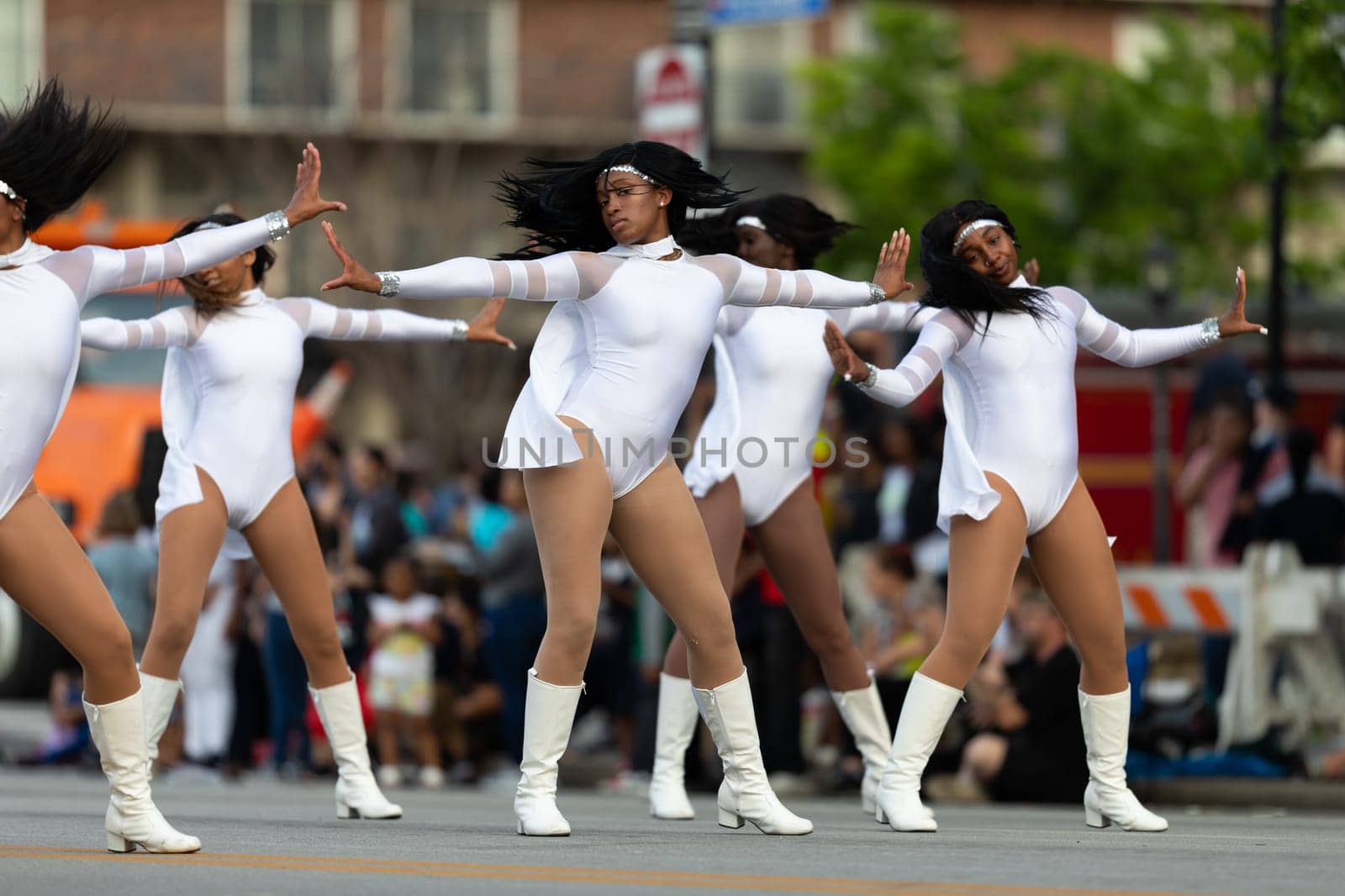 Louisville, Kentucky, USA - May 2, 2019: The Pegasus Parade, women Members of the Dazzling Cardettes, performing dancing during the parade