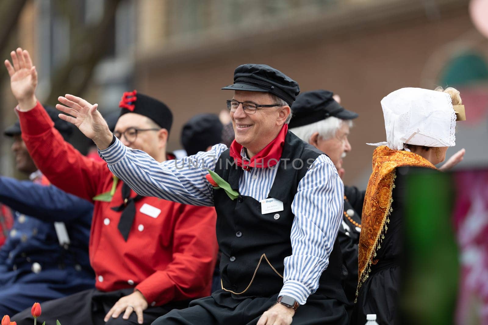 Holland, Michigan, USA - May 11, 2019: Tulip Time Parade, Men wearing traditional dutch clothing, riding on a float during the parade