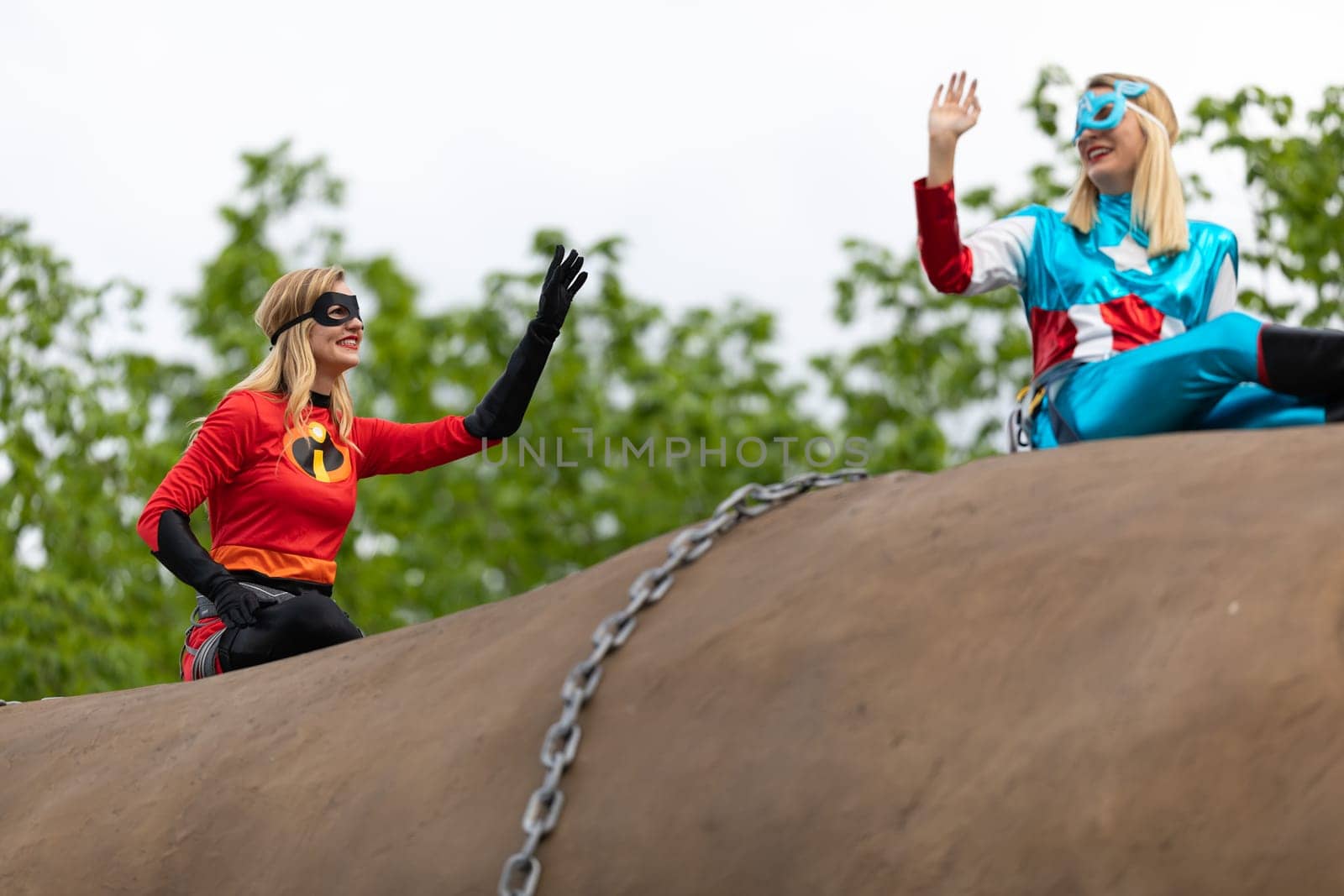 Louisville, Kentucky, USA - May 2, 2019: The Pegasus Parade, Women dress up as superheroes, riding on top of a giant potato during the parade