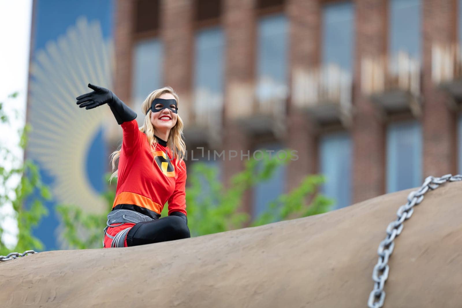 Louisville, Kentucky, USA - May 2, 2019: The Pegasus Parade, Women dress up as superheroes, riding on top of a giant potato during the parade