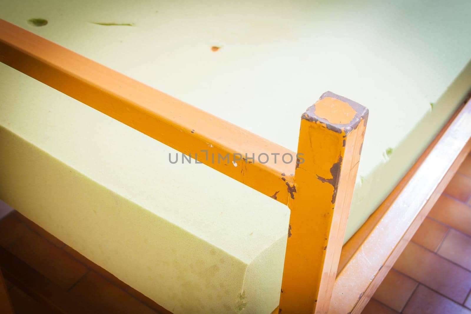 Old psychiatric hospital. Old bed in psychiatric ward