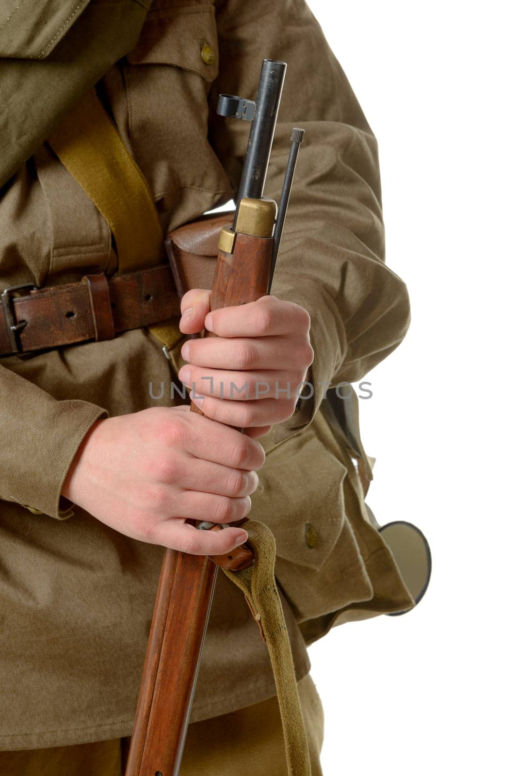 a soldier holding his rifle on the white background