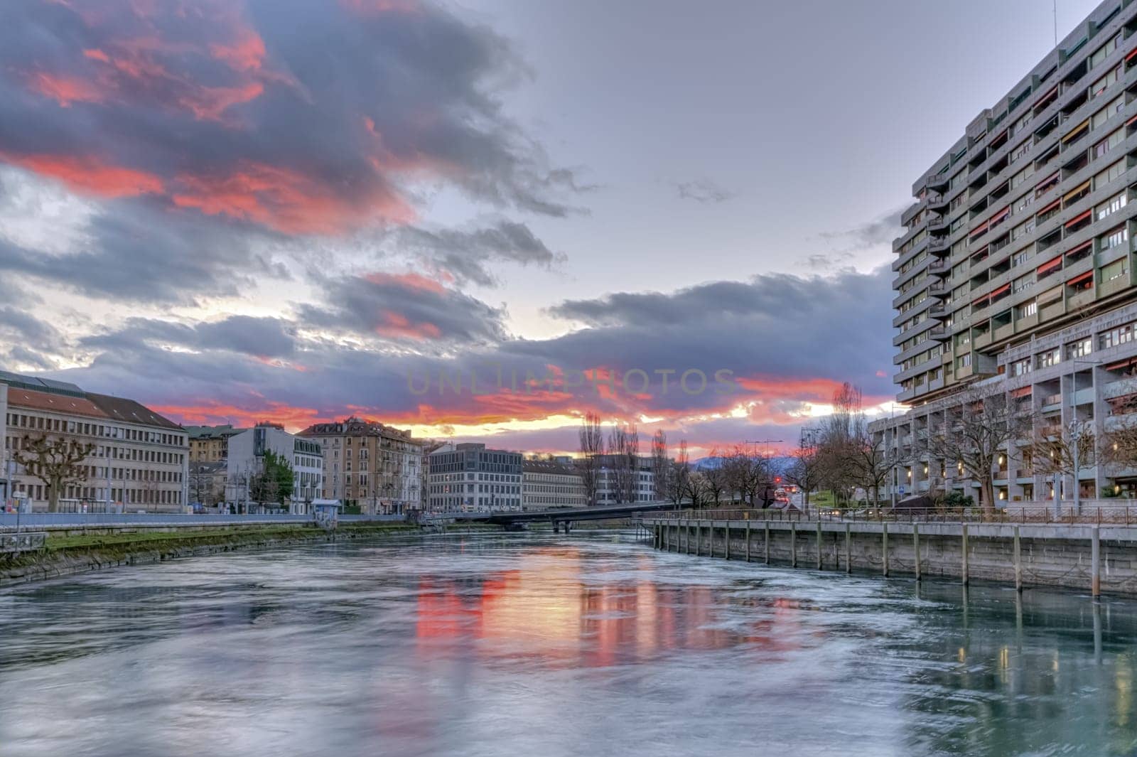 Rhone river, Sous-Terre bridge and buildings by sunset, Geneva, Switzerland, HDR