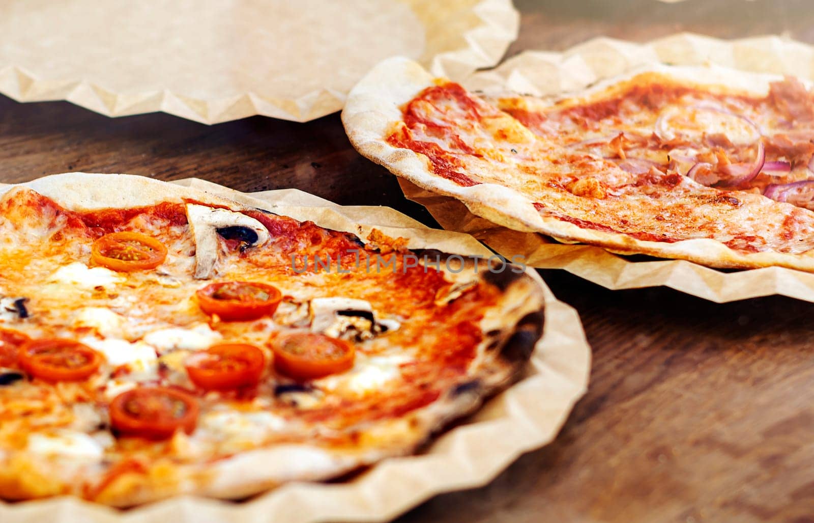 Freshly baked margherita pizza topped with tomato sauce, mozzarella and mushrooms. Typical recipe of Italian cuisine