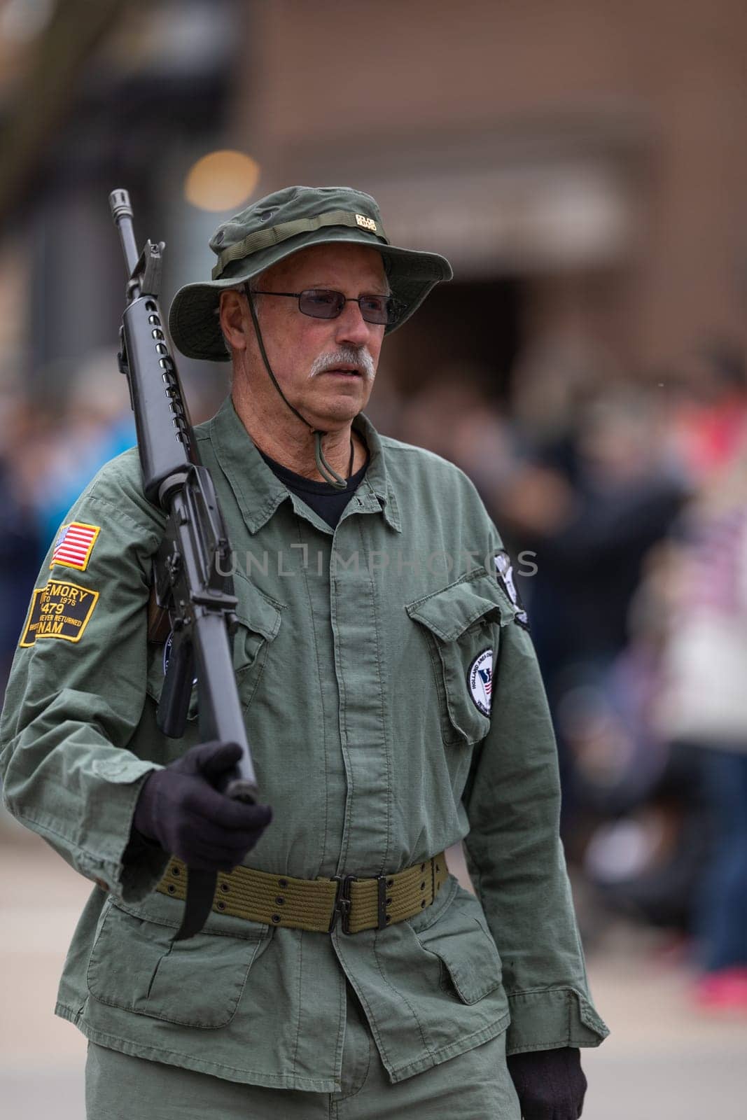 Holland, Michigan, USA - May 11, 2019: Tulip Time Parade, Float transporting United States Military Veterans  down the road during the parade