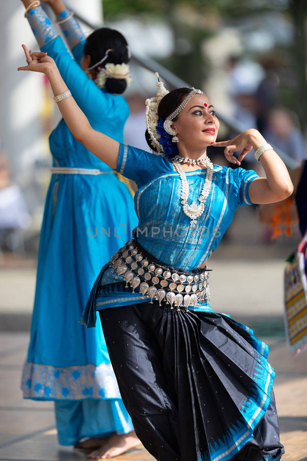Columbus, Ohio, USA - May 26, 2019: Columbus Asian Festival, Franklin Park, Indian women in traditional clothing, performing traditional Indian dance.