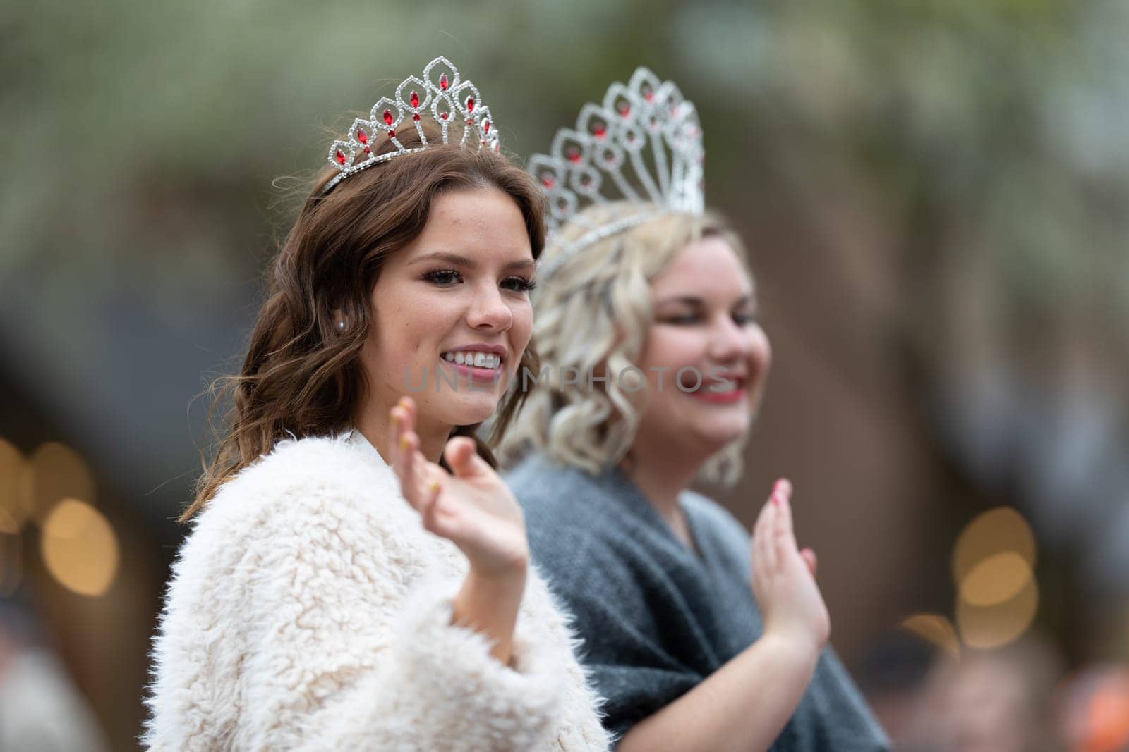 Holland, Michigan, USA - May 11, 2019: Tulip Time Parade, Beauty queens, smiling and waving at the spectators, being transported on the back of a car during the parade