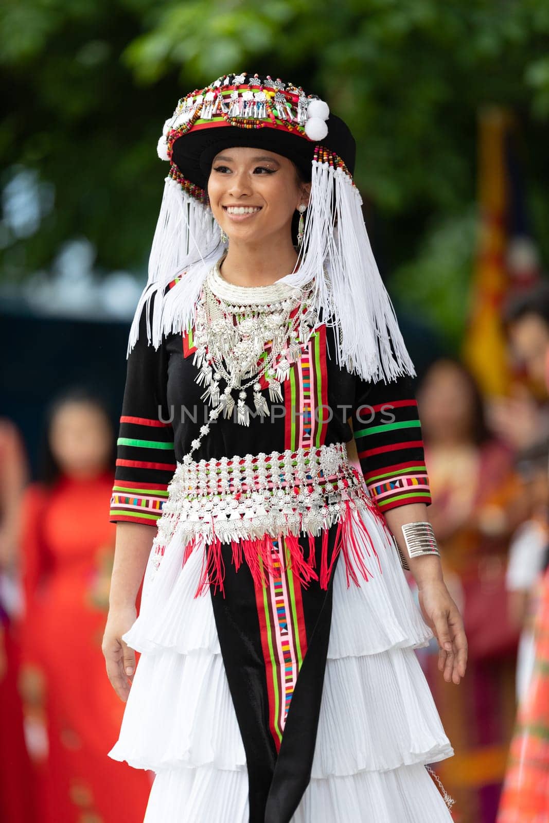 Grand Rapids, Michigan, USA - June 15, 2019: Asian Pacific Festival, hmong people wearing traditional clothing at a fashion display  in the Rosa Parks Circle