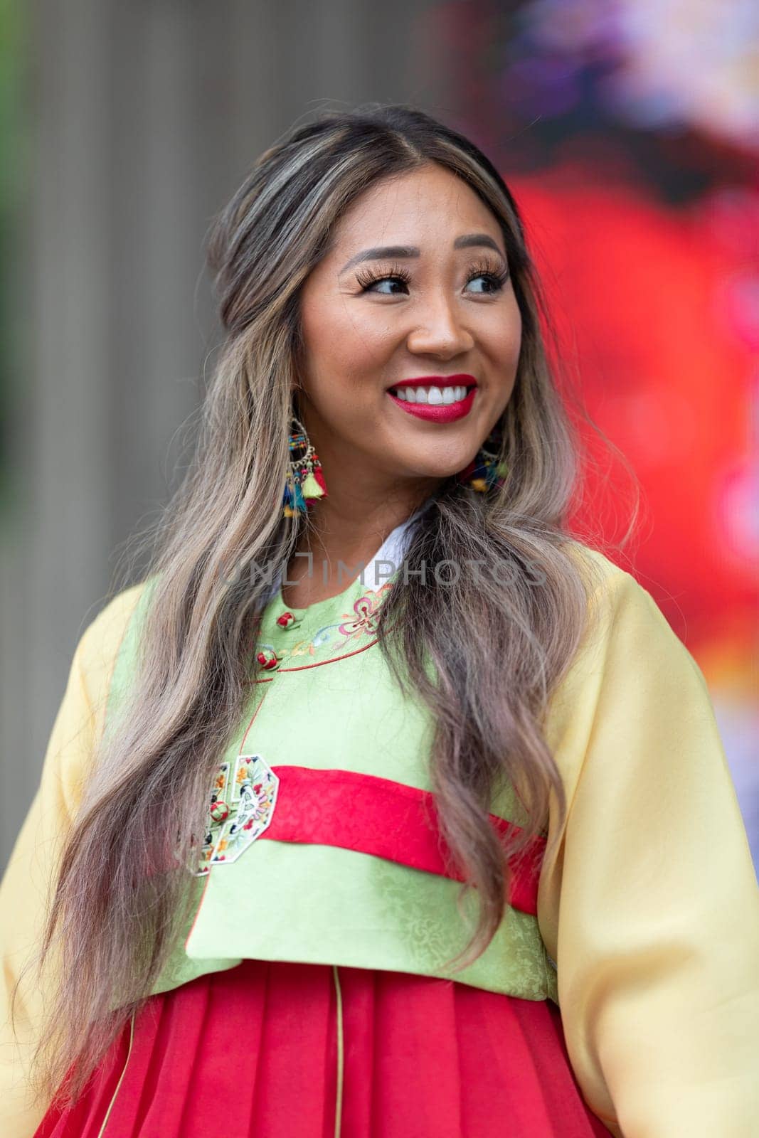 Grand Rapids, Michigan, USA - June 15, 2019: Asian Pacific Festival, korean woman wearing traditional clothing at a fashion display  in the Rosa Parks Circle