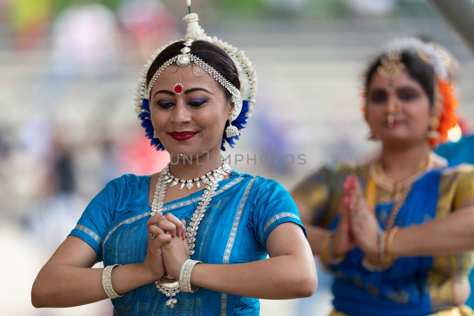 Columbus, Ohio, USA - May 26, 2019: Columbus Asian Festival, Franklin Park, Indian women in traditional clothing, performing traditional Indian dance.