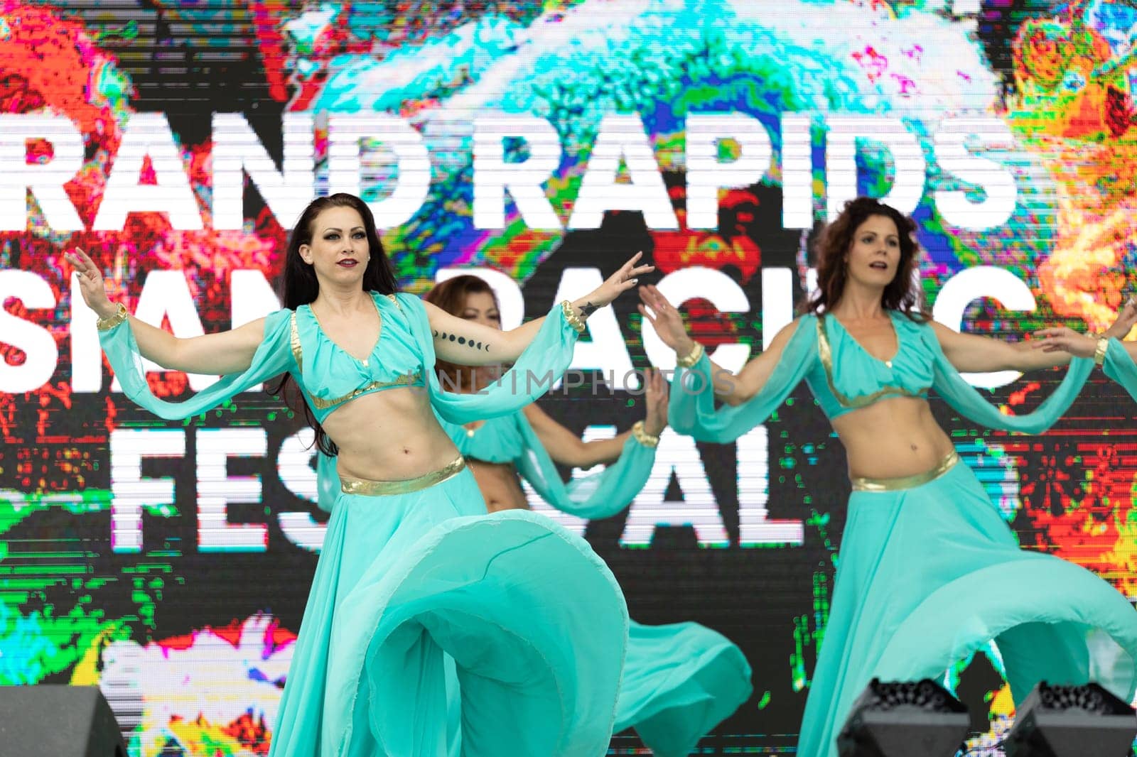 Grand Rapids, Michigan, USA - June 15, 2019: Asian Pacific Festival, Women wearing traditional Egyptian clothing performing traditional dance at the Rosa Parks Circle