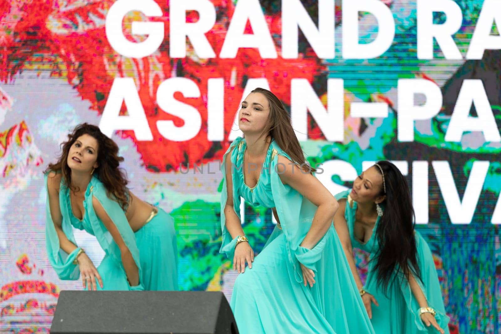 Grand Rapids, Michigan, USA - June 15, 2019: Asian Pacific Festival, Women wearing traditional Egyptian clothing performing traditional dance at the Rosa Parks Circle