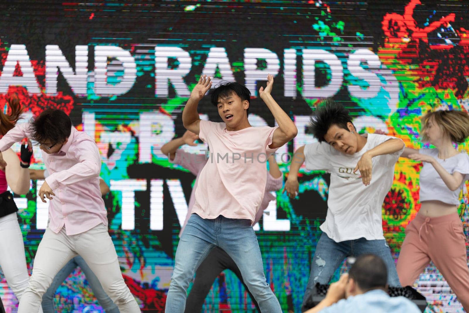 Grand Rapids, Michigan, USA - June 15, 2019: Young Men and Women, performing modern K-POP dance during the asian festival at Rosa Park