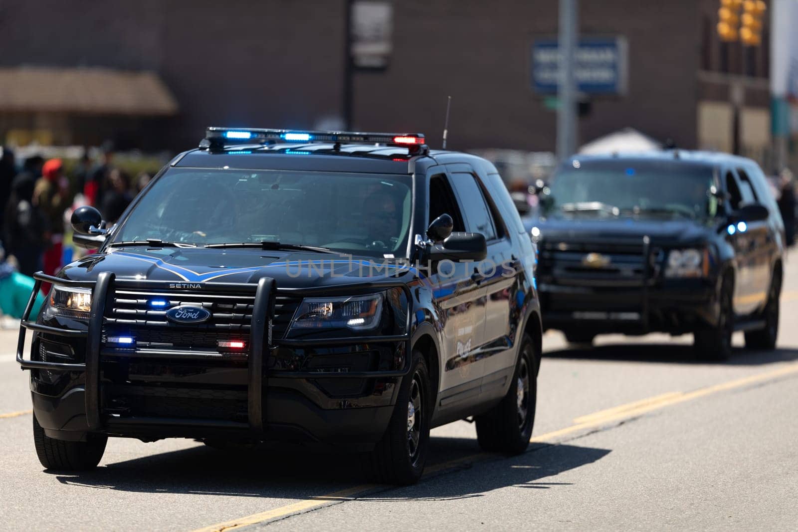 Benton Harbor, Michigan, USA - May 4, 2019: Blossomtime Festival Grand Floral Parade, Michigan police vehicles leading the start of the parade
