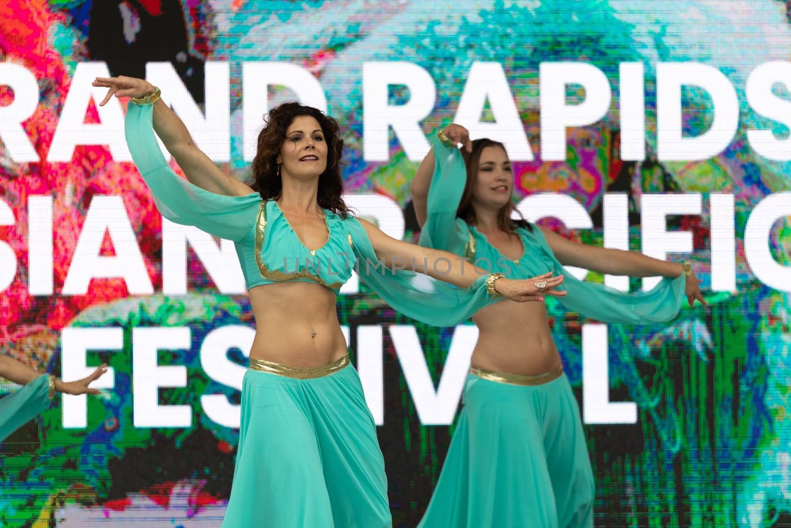 Grand Rapids, Michigan, USA - June 15, 2019: Asian Pacific Festival, Women wearing traditional Egyptian clothing performing traditional dance at the Rosa Parks Circle