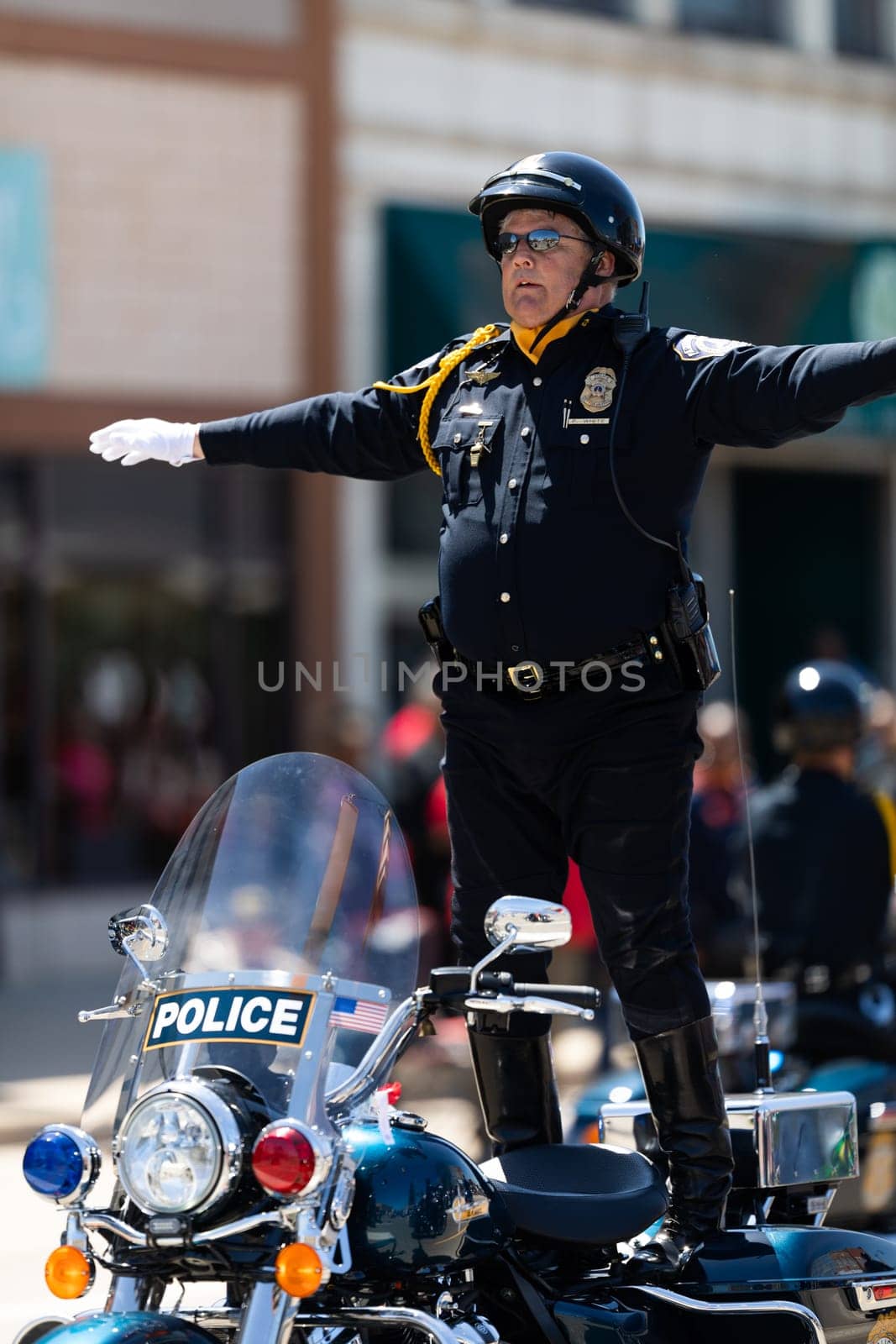 Benton Harbor, Michigan, USA - May 4, 2019: Blossomtime Festival Grand Floral Parade, Indianapolis police motorcycle drill team performing at the parade
