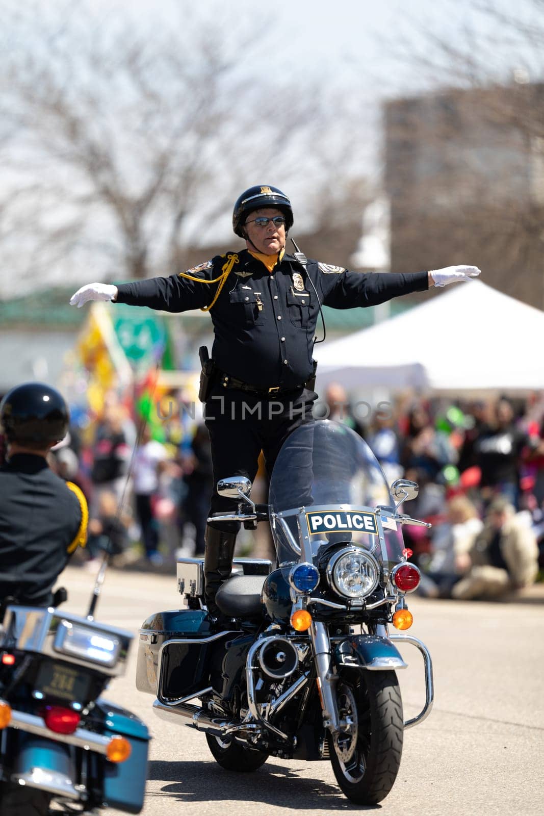 Benton Harbor, Michigan, USA - May 4, 2019: Blossomtime Festival Grand Floral Parade, Indianapolis police motorcycle drill team performing at the parade