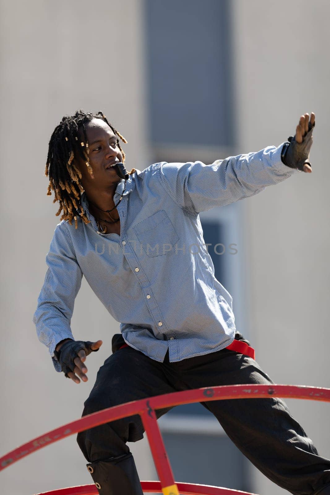 Benton Harbor, Michigan, USA - May 4, 2019: Blossomtime Festival Grand Floral Parade, Sam the wheeler riding a giant wheel at the parade