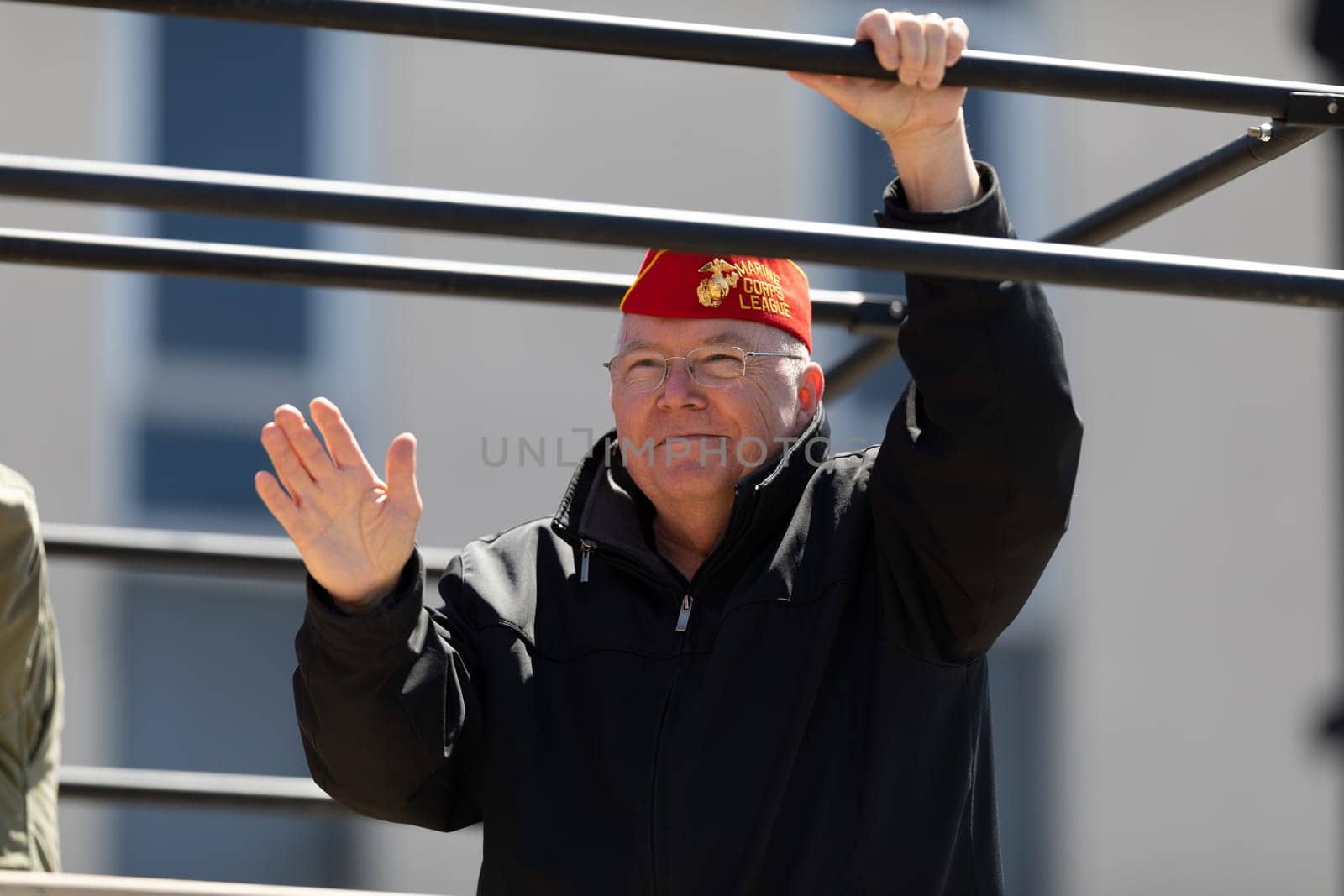Benton Harbor, Michigan, USA - May 4, 2019: Blossomtime Festival Grand Floral Parade, U.S. Military Veteran waving at people during the parade